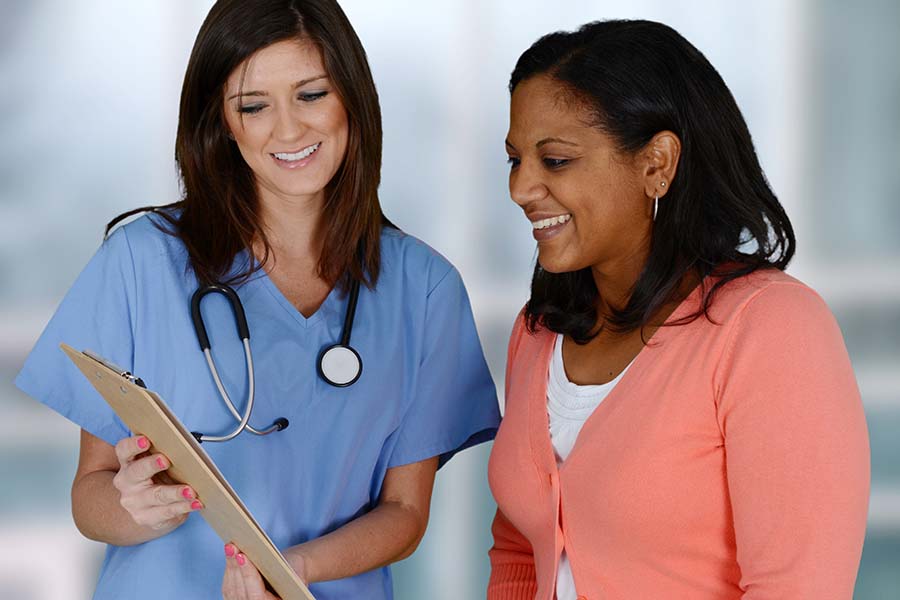 Nurse and Patient Looking at a Chart